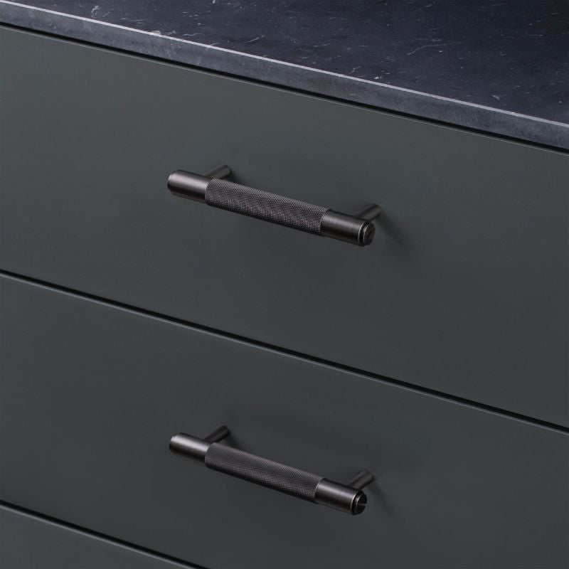 Black Cross Pull Bar Buster and Punch kitchen cabinet handles on black cabinetry