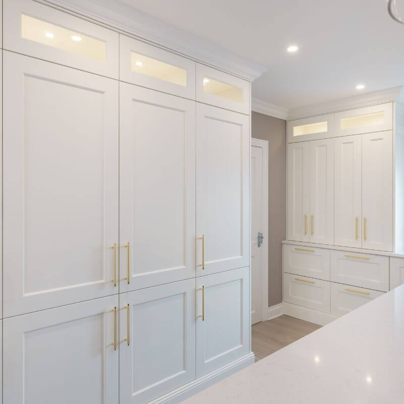 Elegant Gold finish cabinet handles on white kitchen cabinets