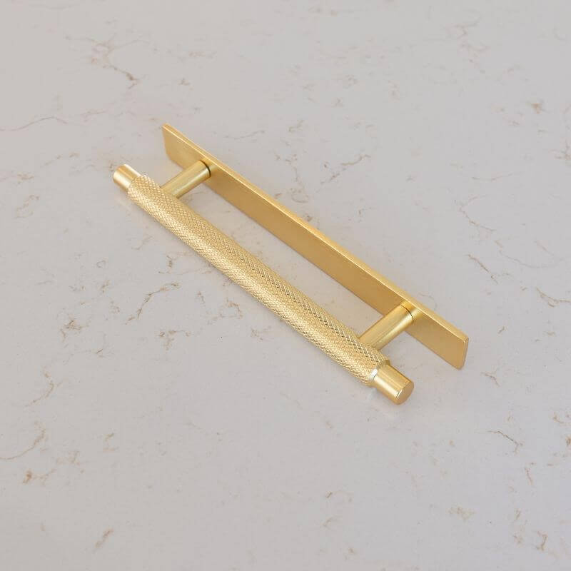 Gold kitchen cabinet Handle with Back Plate on flecked counter top