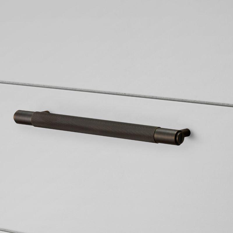 B&P Black Pull Bar Cross Handle on grey background